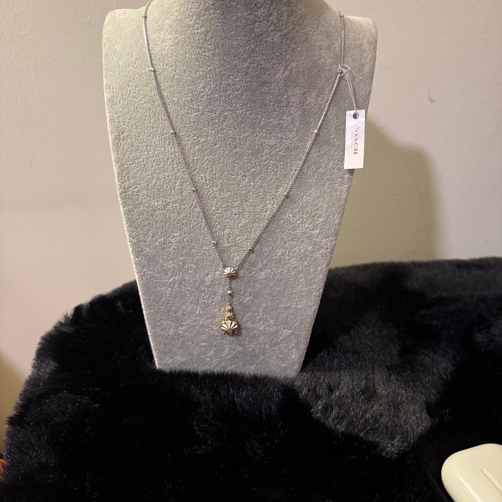 Coach silver necklace with flower pendant